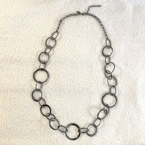 Gunmetal colored long necklace.